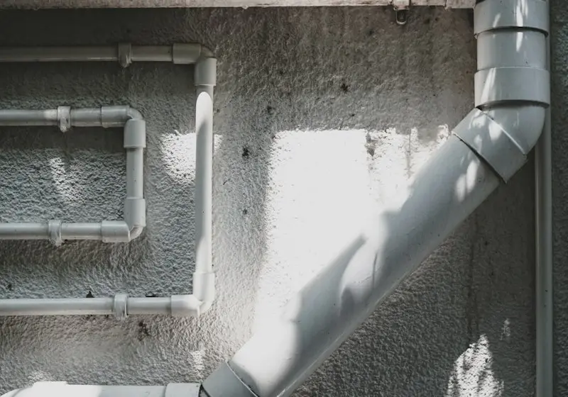 Sewer pipe being replaced in a trench